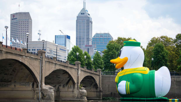 An inflatable of the University of Oregon Duck mascot floats on the White River in front of the NCAA Headquarters on Tuesday