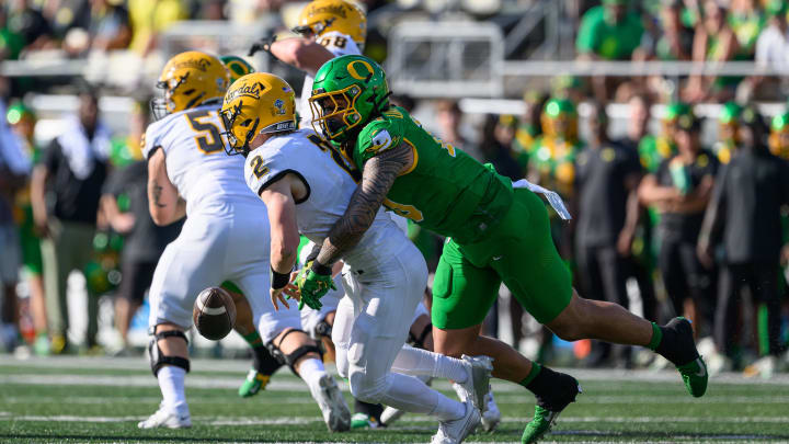 Aug 31, 2024; Eugene, Oregon, USA; Oregon Ducks defensive end Matayo Uiagalelei (10) sacks Idaho Vandals quarterback Jack Layne (2) during the first quarter at Autzen Stadium. Mandatory Credit: Craig Strobeck-USA TODAY Sports