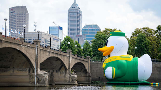 An inflatable of the University of Oregon Duck mascot floats on the White River in front of the NCAA Headquarters on Tuesday,