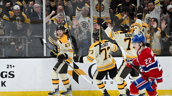 Jan 20, 2024; Boston, Massachusetts, USA; Boston Bruins left wing Danton Heinen (43) celebrates with teammates Charlie McAvoy and Jesper Boqvist after scoring a goal during a game against the Montreal Canadiens at TD Garden