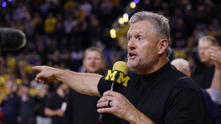 Jan 2, 2026; Ann Arbor, Michigan, USA;  Michigan Wolverines football head coach Kyle Whittingham speaks to the crowd during a time out in the first half against the Southern California Trojans at Crisler Center. Mandatory Credit: Rick Osentoski-Imagn Images
