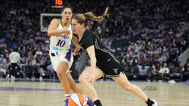 May 16, 2025; San Francisco, California, USA; Golden State Valkyries guard Kate Martin (center) dribbles against Los Angeles Sparks guard Kelsey Plum (10) during the third quarter at Chase Center. Mandatory Credit: Darren Yamashita-Imagn Images