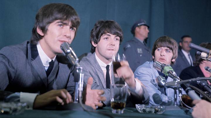 John, Paul, George, and Ringo sit for a press conference at the Delmonico Hotel during their 1964 return to New York City.