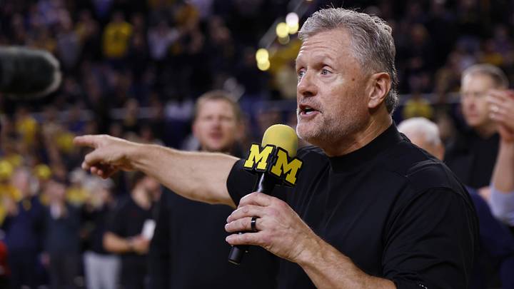 Jan 2, 2026; Ann Arbor, Michigan, USA;  Michigan Wolverines football head coach Kyle Whittingham speaks to the crowd during a time out in the first half against the Southern California Trojans at Crisler Center. Mandatory Credit: Rick Osentoski-Imagn Images