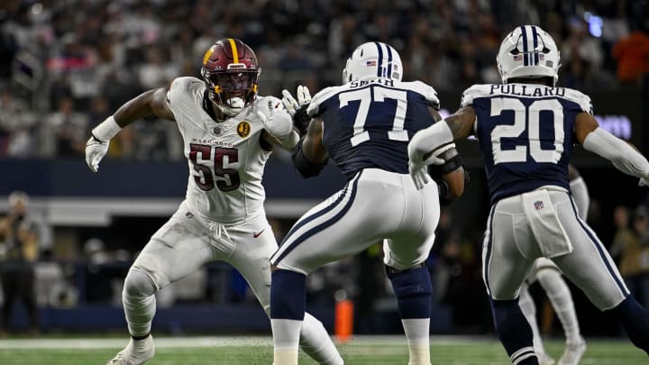 Nov 23, 2023; Arlington, TX; Washington Commanders defensive end KJ Henry (55) and Dallas Cowboys offensive tackle Tyron Smith (77) in action during the game between the Dallas Cowboys and the Washington Commanders