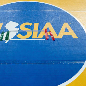 Ankle bracelets sit in the middle of the NJSIAA wrestling mat finals of the NJSIAA individual wrestling state championships at Boardwalk Hall in Atlantic City on Friday, March 8, 2025.