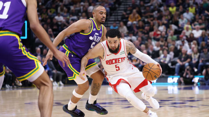 Apr 11, 2024; Salt Lake City, Utah, USA; Houston Rockets guard Fred VanVleet (5) drives against Utah Jazz guard Talen Horton-Tucker (5) during the third quarter at Delta Center. Mandatory Credit: Rob Gray-USA TODAY Sports