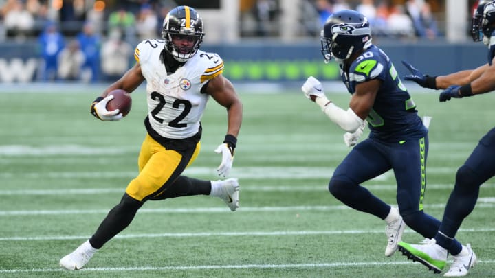 Dec 31, 2023; Seattle, Washington, USA; Pittsburgh Steelers running back Najee Harris (22) carries the ball while chased by Seattle Seahawks cornerback Michael Jackson (30) during the second half at Lumen Field. Mandatory Credit: Steven Bisig-USA TODAY Sports