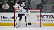 Apr 10, 2025; Dallas, Texas, USA; Winnipeg Jets goaltender Connor Hellebuyck (37) celebrates on the ice after getting the shutout win over the Dallas Stars at the American Airlines Center. Mandatory Credit: Jerome Miron-Imagn Images