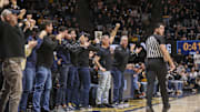 Feb 8, 2025; Morgantown, West Virginia, USA; West Virginia Mountaineers fans cheer during the first half against the Utah Utes at WVU Coliseum. Mandatory Credit: Ben Queen-Imagn Images