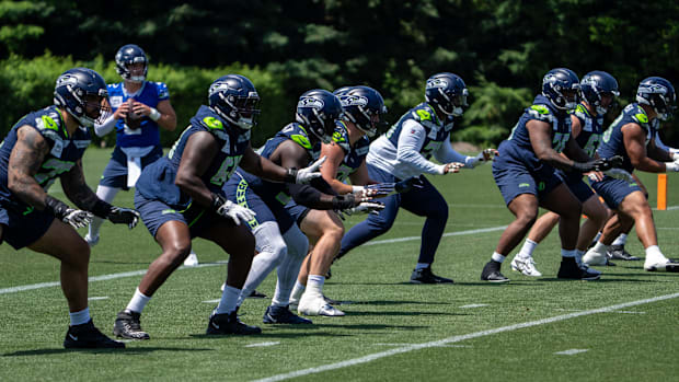 Seattle Seahawks offensive line units take part in drills during mini-camp