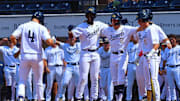 May 30, 2025; Oxford, MS, USA; Georgia Tech Yellowjackets catcher Vahn Lackey (25), shortstop Kyle Lodise (2), first base Kent Schmidt (10) and outfielder Caleb Daniel (6) react with outfielder Alex Hernandez (4) after a three run home run during the first inning against the Western Kentucky Hilltoppers. Mandatory Credit: Petre Thomas-Imagn Images