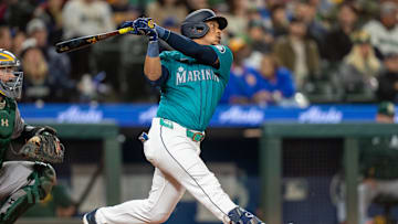 Sep 28, 2024; Seattle, Washington, USA; Seattle Mariners designated hitter Jorge Polanco (7) hits a two-run single during the fourth inning against the Oakland Athletics at T-Mobile Park. Mandatory Credit: Stephen Brashear-Imagn Images