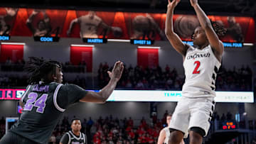 Cincinnati Bearcats guard Jizzle James (2) shoots a fade away basket in the second half of the NCAA Big 12 basketball game between the Cincinnati Bearcats and the Kansas State Wildcats at Fifth Third Arena in Cincinnati on Saturday, March 2, 2024. The Bearcats collected a 74-72 conference win.