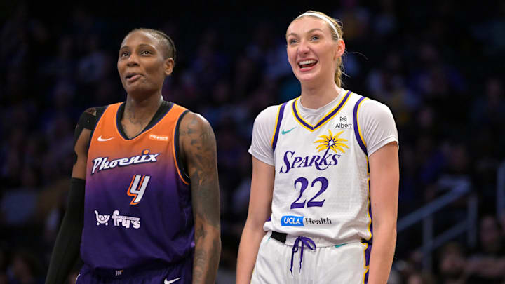 Aug 26, 2025; Los Angeles, California, USA;  Phoenix Mercury forward Natasha Mack (4) and Los Angeles Sparks forward Cameron Brink (22) laugh as they wait on the free throw line during the first half at Crypto.com Arena. Mandatory Credit: Jayne Kamin-Oncea-Imagn Images