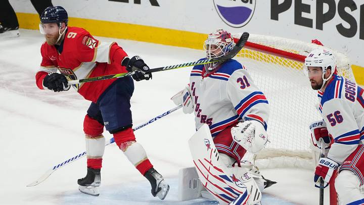 Jun 1, 2024; Sunrise, Florida, USA; The stick of Florida Panthers center Sam Bennett (9) collides with New York Rangers goaltender Igor Shesterkin (31) during the second period in game six of the Eastern Conference Final of the 2024 Stanley Cup Playoffs at Amerant Bank Arena. Mandatory Credit: Jim Rassol-Imagn Images
