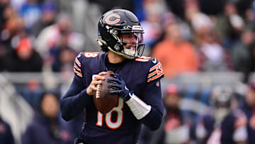 Dec 22, 2024; Chicago, Illinois, USA; Chicago Bears quarterback Caleb Williams (18) looks to pass against the Detroit Lions during the second quarter at Soldier Field. Mandatory Credit: Daniel Bartel-Imagn Images