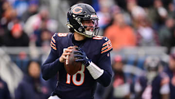 Dec 22, 2024; Chicago, Illinois, USA; Chicago Bears quarterback Caleb Williams (18) looks to pass against the Detroit Lions during the second quarter at Soldier Field.