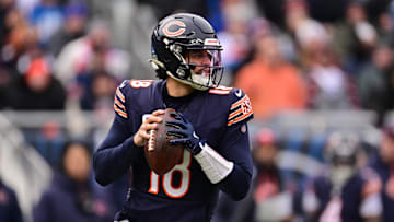 Dec 22, 2024; Chicago, Illinois, USA; Chicago Bears quarterback Caleb Williams (18) looks to pass against the Detroit Lions during the second quarter at Soldier Field. Mandatory Credit: Daniel Bartel-Imagn Images
