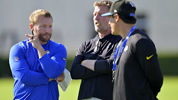 Jul 29, 2024; Los Angeles, CA, USA; Los Angeles Rams head coach Sean McVay, general manager Les Snead, and chief of staff Carter Crutchfield talk on the field during training camp at Loyola Marymount University. Mandatory Credit: Jayne Kamin-Oncea-Imagn Images