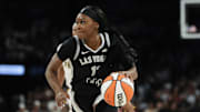 Sep 21, 2025; Las Vegas, Nevada, USA; Las Vegas Aces guard Dana Evans (11) dribbles the ball against the Indiana Fever during the third quarter in game one of the second round for the 2025 WNBA Playoffs at Michelob Ultra Arena. Mandatory Credit: Lucas Peltier-Imagn Images