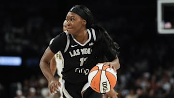 Sep 21, 2025; Las Vegas, Nevada, USA; Las Vegas Aces guard Dana Evans (11) dribbles the ball against the Indiana Fever during the third quarter in game one of the second round for the 2025 WNBA Playoffs at Michelob Ultra Arena. Mandatory Credit: Lucas Peltier-Imagn Images