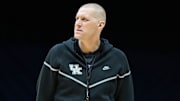 Kentucky Wildcats head coach Mark Pope walks onto the court Thursday, March 27, 2025, during practice ahead of the Sweet 16 March Madness tournament game against the Tennessee Volunteers at Lucas Oil Stadium in Indianapolis.