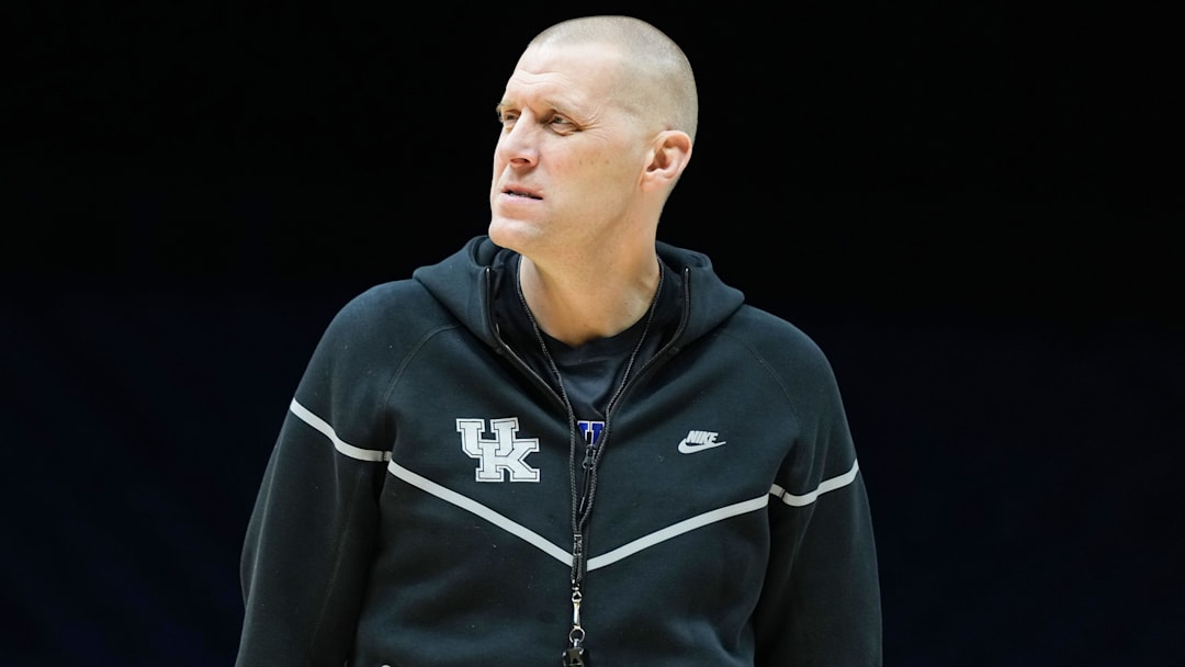 Kentucky Wildcats head coach Mark Pope walks onto the court Thursday, March 27, 2025, during practice ahead of the Sweet 16 March Madness tournament game against the Tennessee Volunteers at Lucas Oil Stadium in Indianapolis.