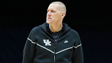 Kentucky Wildcats head coach Mark Pope walks onto the court Thursday, March 27, 2025, during practice ahead of the Sweet 16 March Madness tournament game against the Tennessee Volunteers at Lucas Oil Stadium in Indianapolis.