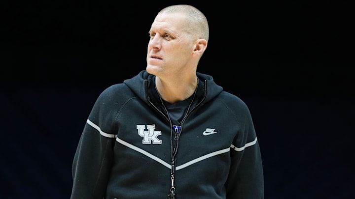 Kentucky Wildcats head coach Mark Pope walks onto the court Thursday, March 27, 2025, during practice ahead of the Sweet 16 March Madness tournament game against the Tennessee Volunteers at Lucas Oil Stadium in Indianapolis.