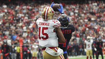 Houston Texans cornerback Kamari Lassiter (4) intercepts a pass intended for San Francisco 49ers wide receiver Jauan Jennings (15)