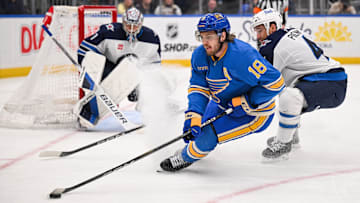 Feb 22, 2025; St. Louis, Missouri, USA; St. Louis Blues center Robert Thomas (18) controls the puck against the Winnipeg Jets during the third period at Enterprise Center. Mandatory Credit: Connor Hamilton-Imagn Images