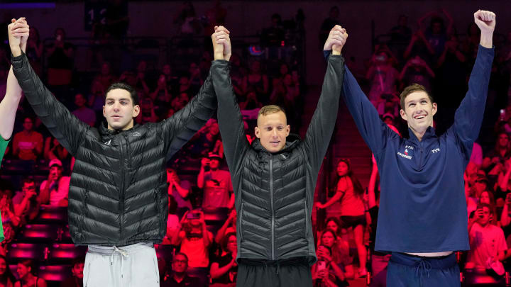 Jack Alexy (left), Caeleb Dressel and Hunter Armstrong (right)