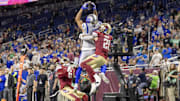 Mar 30, 2024; Detroit, MI, USA; St. Louis Battlehawks wide receiver Marcell Ateman (3) jumps for a catch between Michigan Panthers safety Kai Nacua (21) and cornerback Keith Gipson (6) during the second half at Ford Field. Mandatory Credit: David Reginek-Imagn Images