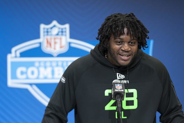 Missouri offensive lineman Armand Membou answers questions at a press conference during the 2025 NFL Combine.