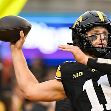 Oct 18, 2025; Iowa City, Iowa, USA; Iowa Hawkeyes quarterback Mark Gronowski (11) warms up before the game against the Penn State Nittany Lions at Kinnick Stadium. Mandatory Credit: Jeffrey Becker-Imagn Images