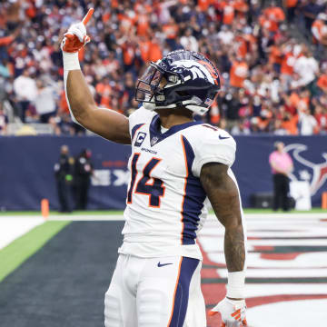 Dec 3, 2023; Houston, Texas, USA; Denver Broncos wide receiver Courtland Sutton (14) celebrates his touchdown reception against the Houston Texans in the second half at NRG Stadium. 