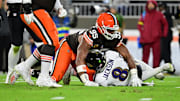 Nov 16, 2025; Cleveland, Ohio, USA; Cleveland Browns defensive end Myles Garrett (95) reacts after sacking Baltimore Ravens quarterback Lamar Jackson (8) during the second quarter at Huntington Bank Field. Mandatory Credit: Ken Blaze-Imagn Images
