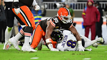 Nov 16, 2025; Cleveland, Ohio, USA; Cleveland Browns defensive end Myles Garrett (95) reacts after sacking Baltimore Ravens quarterback Lamar Jackson (8) during the second quarter at Huntington Bank Field. Mandatory Credit: Ken Blaze-Imagn Images