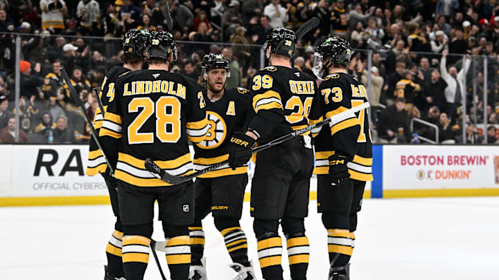 Dec 16, 2025; Boston, Massachusetts, USA; Boston Bruins center Morgan Geekie (39) celebrates his goal that was assisted by right wing David Pastrnak (88) during the first period against the Utah Mammoth at TD Garden. Mandatory Credit: Eric Canha-Imagn Images