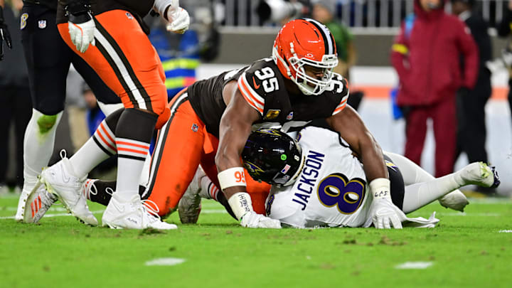 Nov 16, 2025; Cleveland, Ohio, USA; Cleveland Browns defensive end Myles Garrett (95) reacts after sacking Baltimore Ravens quarterback Lamar Jackson (8) during the second quarter at Huntington Bank Field. Mandatory Credit: Ken Blaze-Imagn Images