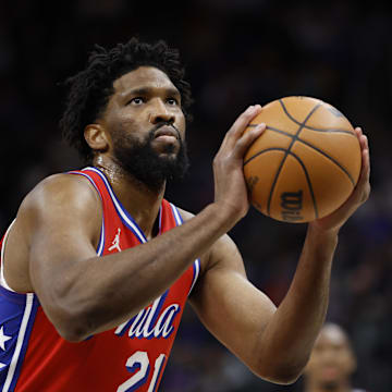 Feb 7, 2025; Detroit, Michigan, USA;  Philadelphia 76ers center Joel Embiid (21) shoots in the first half against the Detroit Red Wings at Little Caesars Arena. Mandatory Credit: Rick Osentoski-Imagn Images
