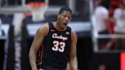 Jan 11, 2025; Salt Lake City, Utah, USA; Oklahoma State Cowboys forward Abou Ousmane (33) reacts to a play against the Utah Utes during the second half at Jon M. Huntsman Center. Mandatory Credit: Rob Gray-Imagn Images