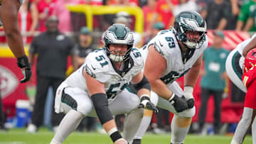 Sep 14, 2025; Kansas City, Missouri, USA; Philadelphia Eagles center Cam Jurgens (51) and guard Landon Dickerson (69) at the line of scrimmage against the Kansas City Chiefs during the second half of the game at GEHA Field at Arrowhead Stadium. Mandatory Credit: Denny Medley-Imagn Images