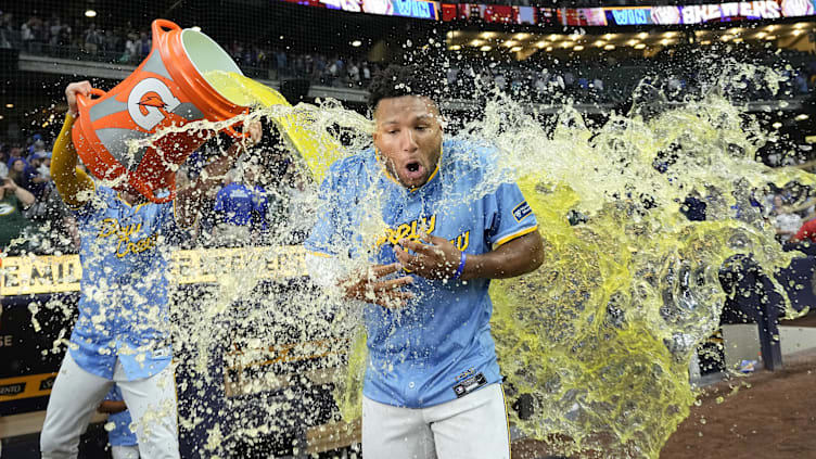 Jun 28, 2024; Milwaukee, Wisconsin, USA;  Milwaukee Brewers left fielder Jackson Chourio (11) is dunked with Gatorade following the game against the Chicago Cubs at American Family Field. Mandatory Credit: Jeff Hanisch-USA TODAY Sports