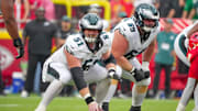 Sep 14, 2025; Kansas City, Missouri, USA; Philadelphia Eagles center Cam Jurgens (51) and guard Landon Dickerson (69) at the line of scrimmage against the Kansas City Chiefs during the second half of the game at GEHA Field at Arrowhead Stadium. Mandatory Credit: Denny Medley-Imagn Images