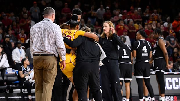Mar 24, 2025; Los Angeles, California, USA; USC Trojans guard JuJu Watkins (12) is carried off the court after injuring his k