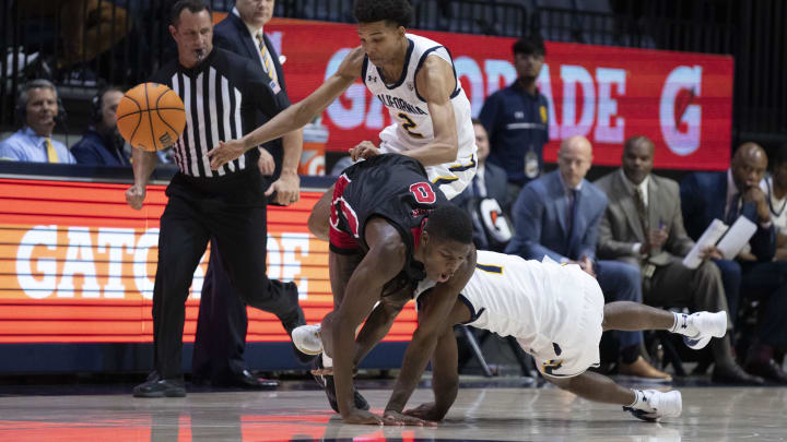 December 7, 2022; Berkeley, California, USA; California Golden Bears forward Monty Bowser (2) and guard Joel Brown (1) go after the loose ball with Eastern Washington Eagles forward Cedric Coward (0) during the second half at Haas Pavilion. Mandatory Credit: Kyle Terada-USA TODAY Sports