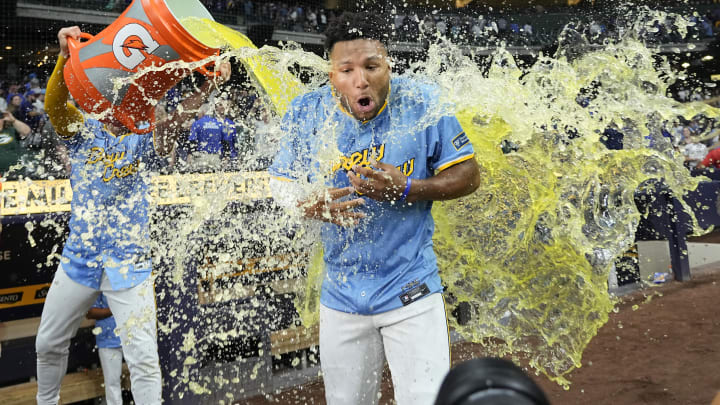 Jun 28, 2024; Milwaukee, Wisconsin, USA;  Milwaukee Brewers left fielder Jackson Chourio (11) is dunked with Gatorade following the game against the Chicago Cubs at American Family Field. Mandatory Credit: Jeff Hanisch-USA TODAY Sports