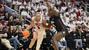 Dec 4, 2025; Louisville, Kentucky, USA; Louisville Cardinals forward Laura Ziegler (0) drives to the basket against South Carolina Gamecocks center Madina Okot (11) during the first half at KFC Yum! Center. Mandatory Credit: Jamie Rhodes-Imagn Images